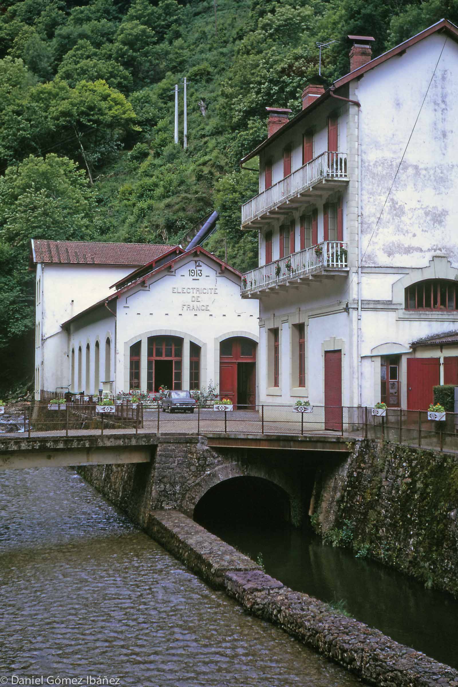 Early industries in the Pyrenees included forestry, iron and copper mining and smelting, and charcoal production. In modern times hydroelectric power grew in importance, though most power plants were small. This hydro station was built in 1913. [near Banca, Pyrénées-Atlantiques, 1973