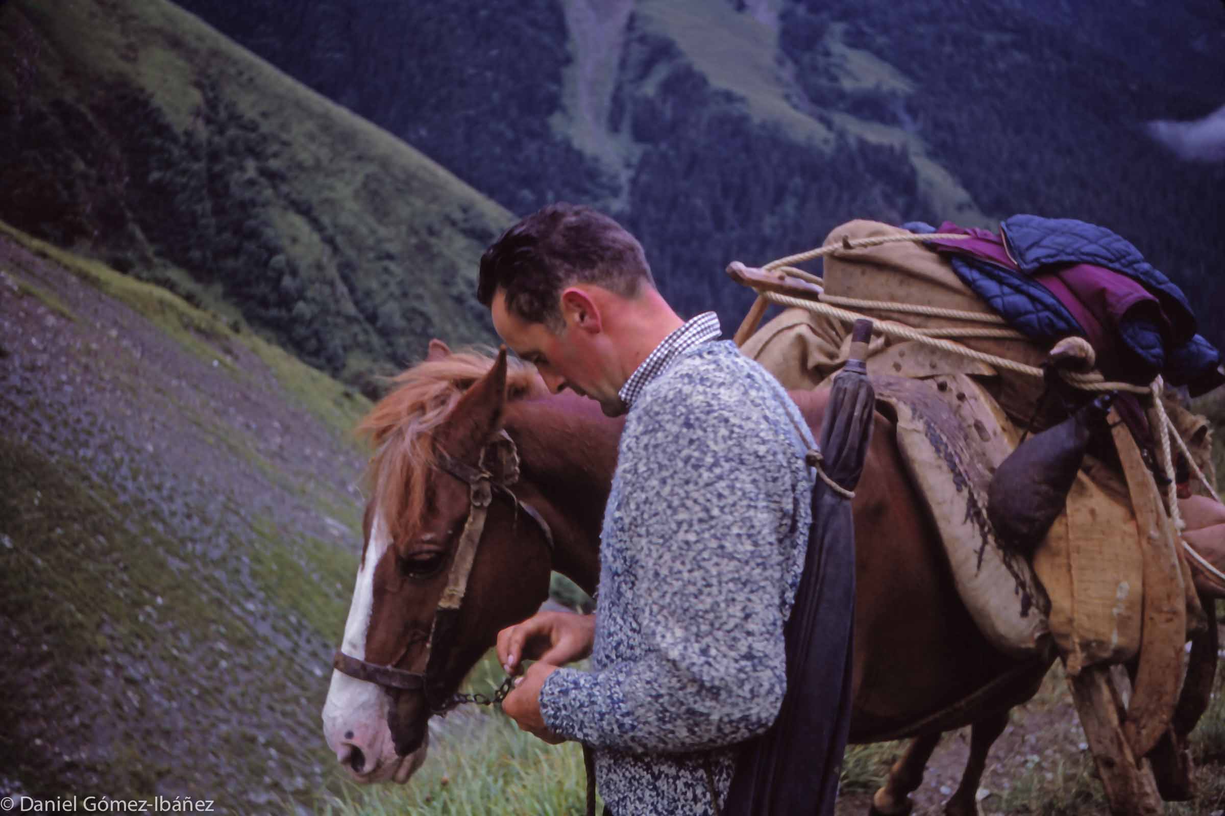 A pause on the climb. In addition to supplies for the herder there are bags of salt for the cattle.