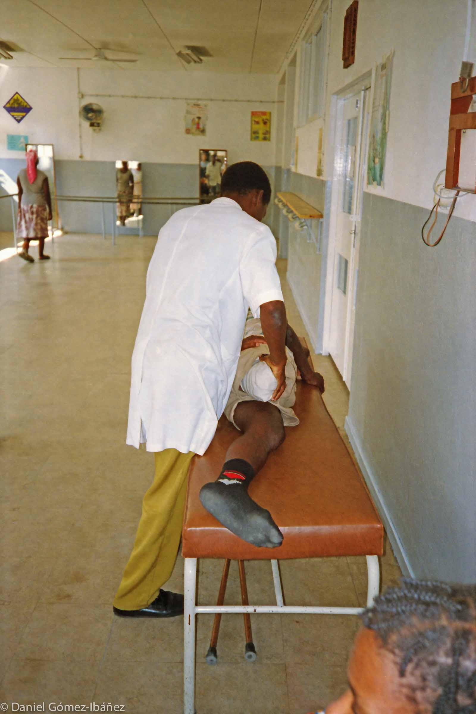 Before receiving his first artifical leg, Paolo Chichava's stump is exercised by a physiotherapist. © 1997